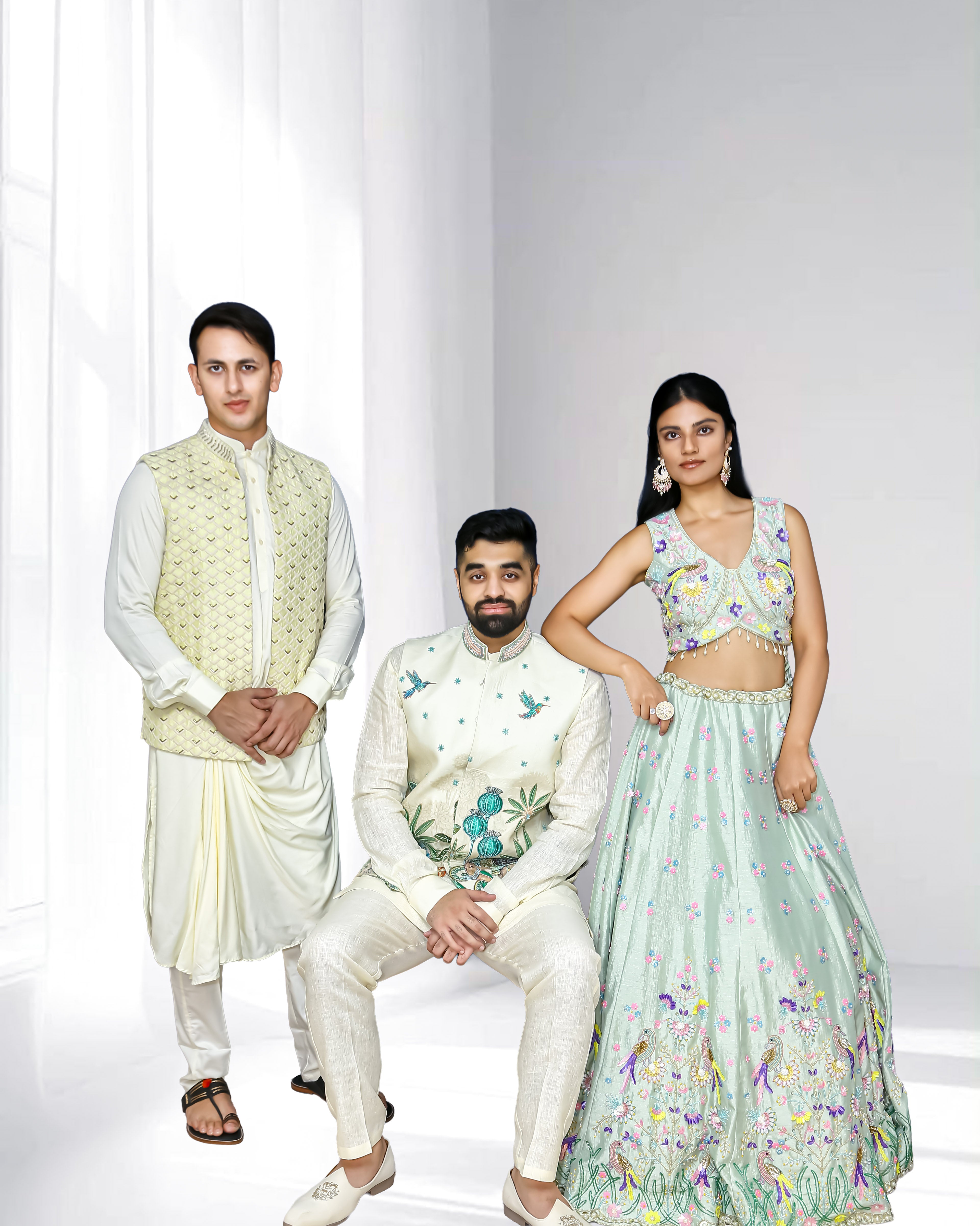 Pastel ethnic wear collection featuring a woman in a mint embroidered lehenga and two men in ivory sherwanis with embroidered details, styled for weddings and festive occasions