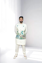 Man wearing a traditional embroidered Kurta Pajama with Nehru Jacket on a white background