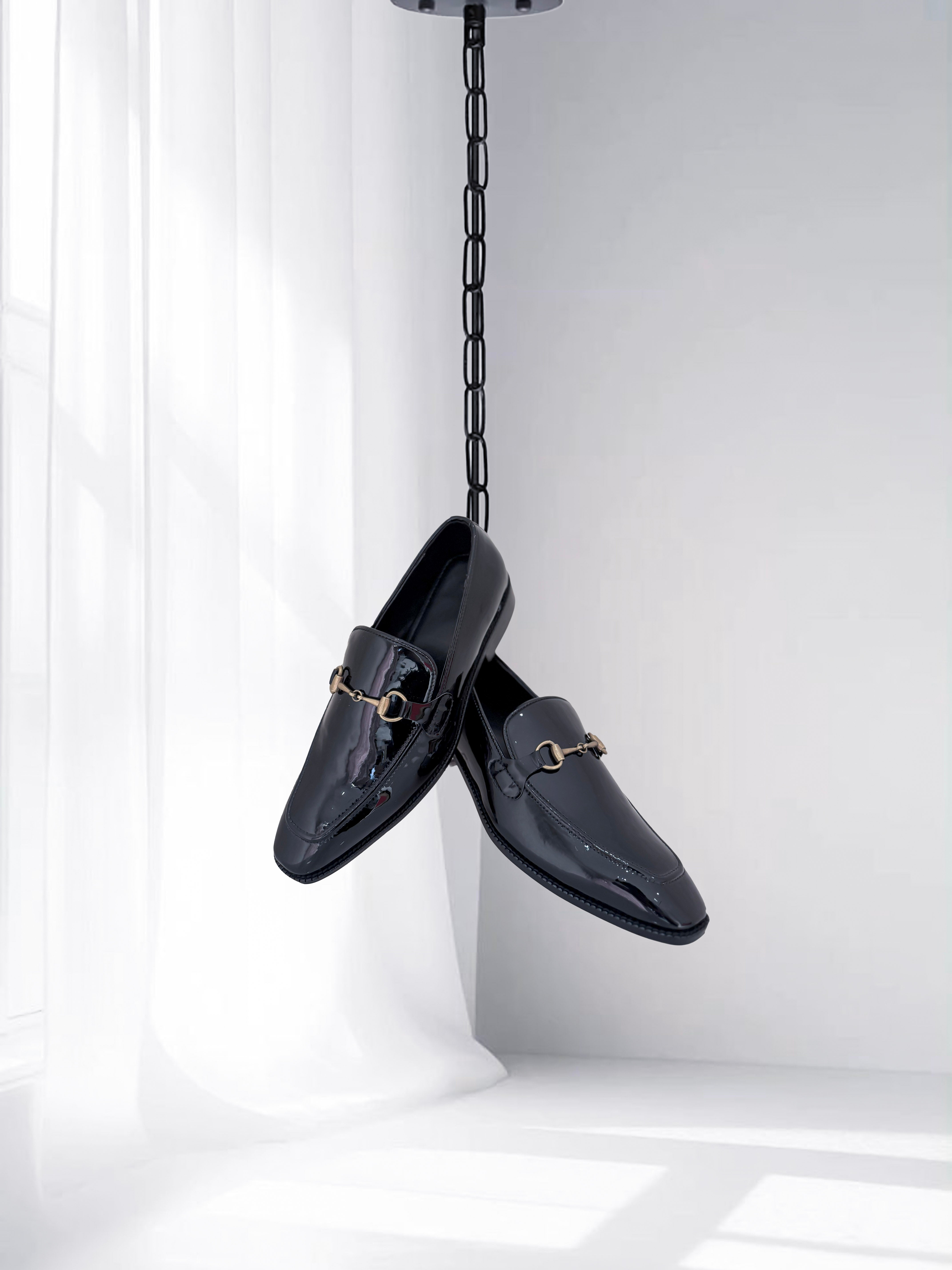 Men’s black patent leather loafers with gold buckle – tuxedo and wedding shoes.